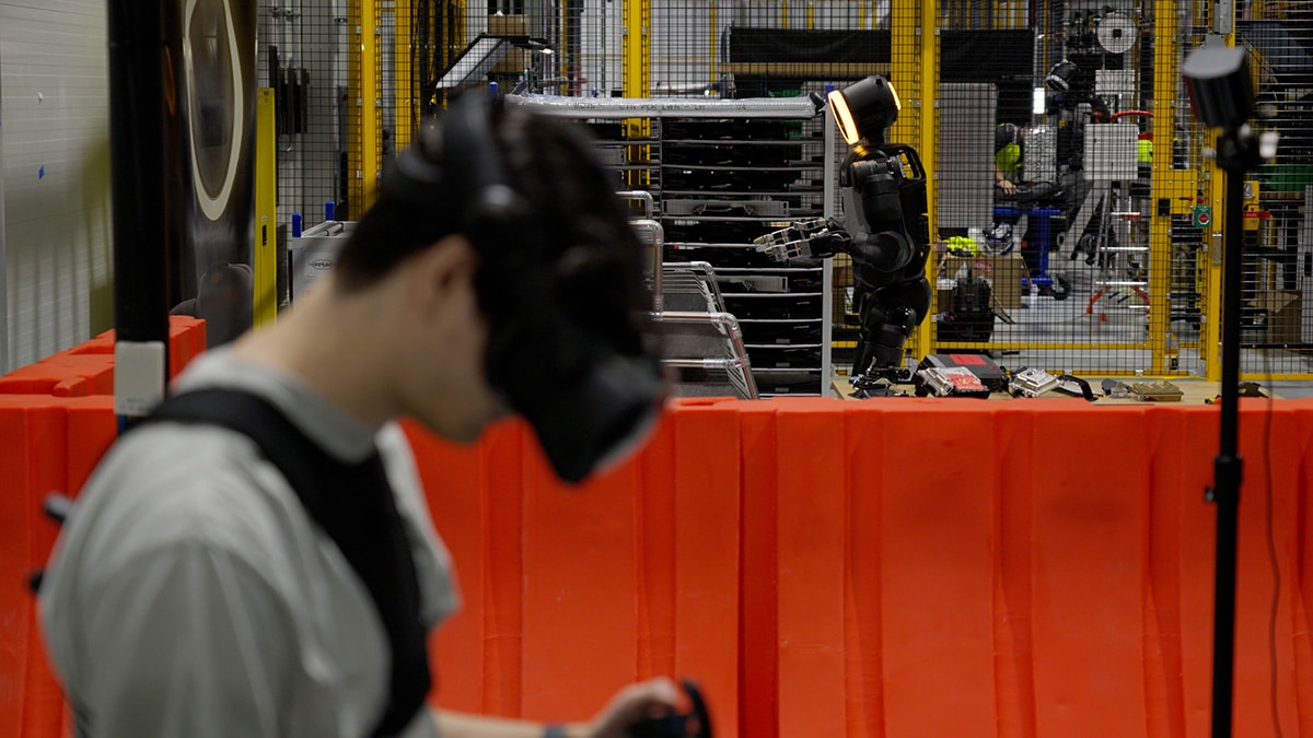A trainer teleoperates Boston Dynamics Atlas robot at RMAC